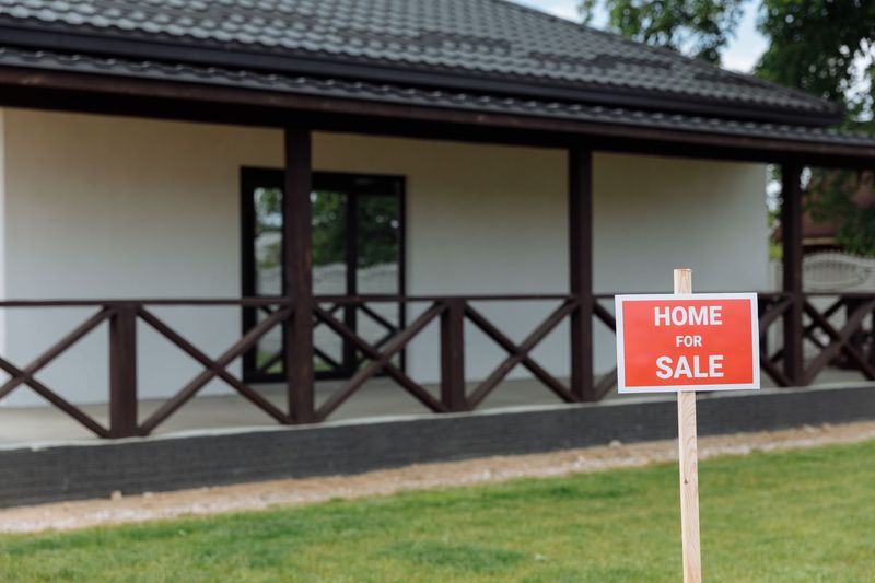 Real estate agent welcoming clients into a home